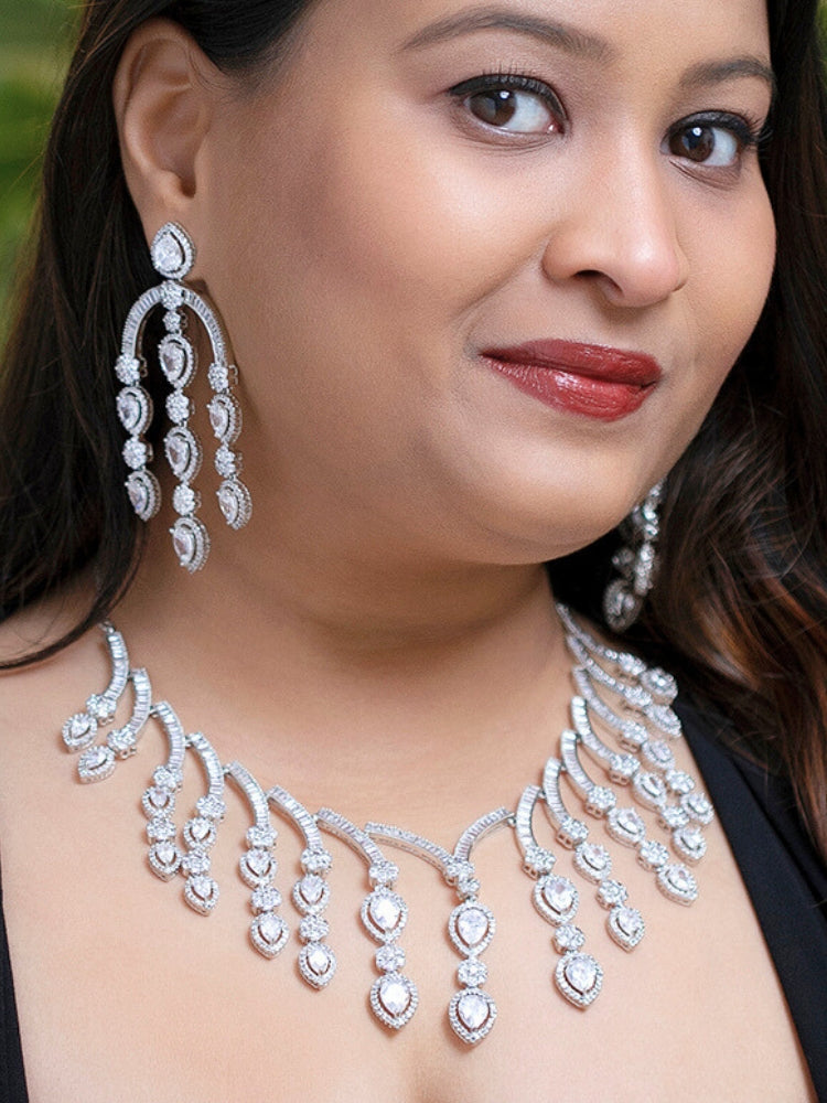 A woman showcasing a beautiful artificial diamond necklace and earrings set, ideal for festivals, family gatherings, and special celebrations in India. This elegant diamond jewelry provides the perfect blend of sparkle and tradition, with a modern twist.