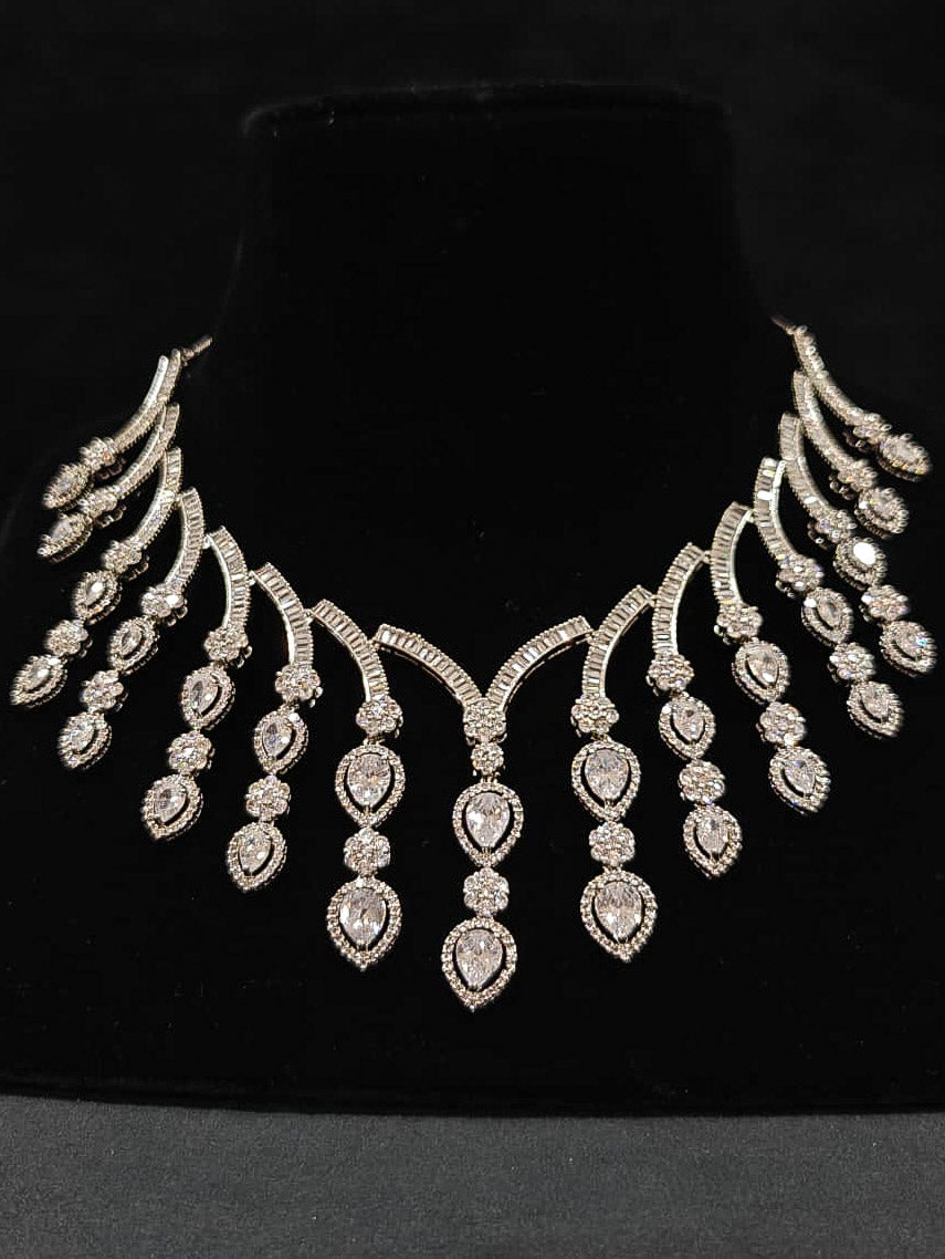 An exquisite artificial diamond necklace and matching earrings, designed for the perfect engagement look. This stunning artificial diamond jewelry set offers luxury and sophistication while being an affordable alternative to natural diamonds.