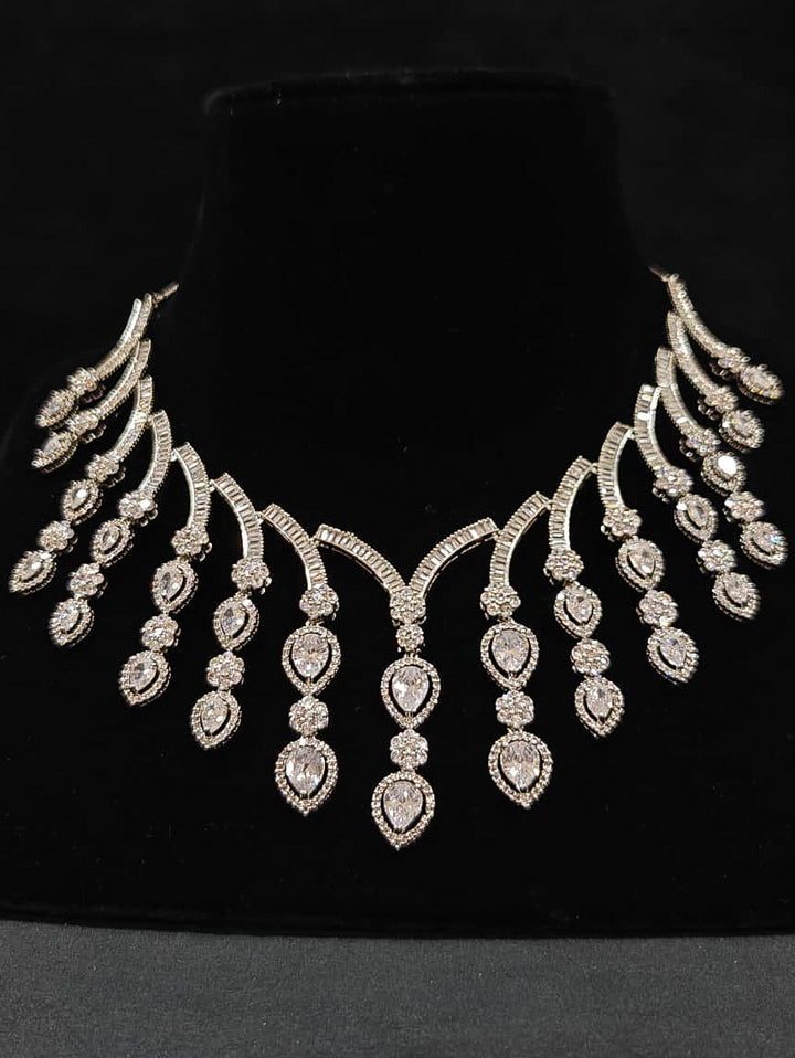 An exquisite artificial diamond necklace and matching earrings, designed for the perfect engagement look. This stunning artificial diamond jewelry set offers luxury and sophistication while being an affordable alternative to natural diamonds.