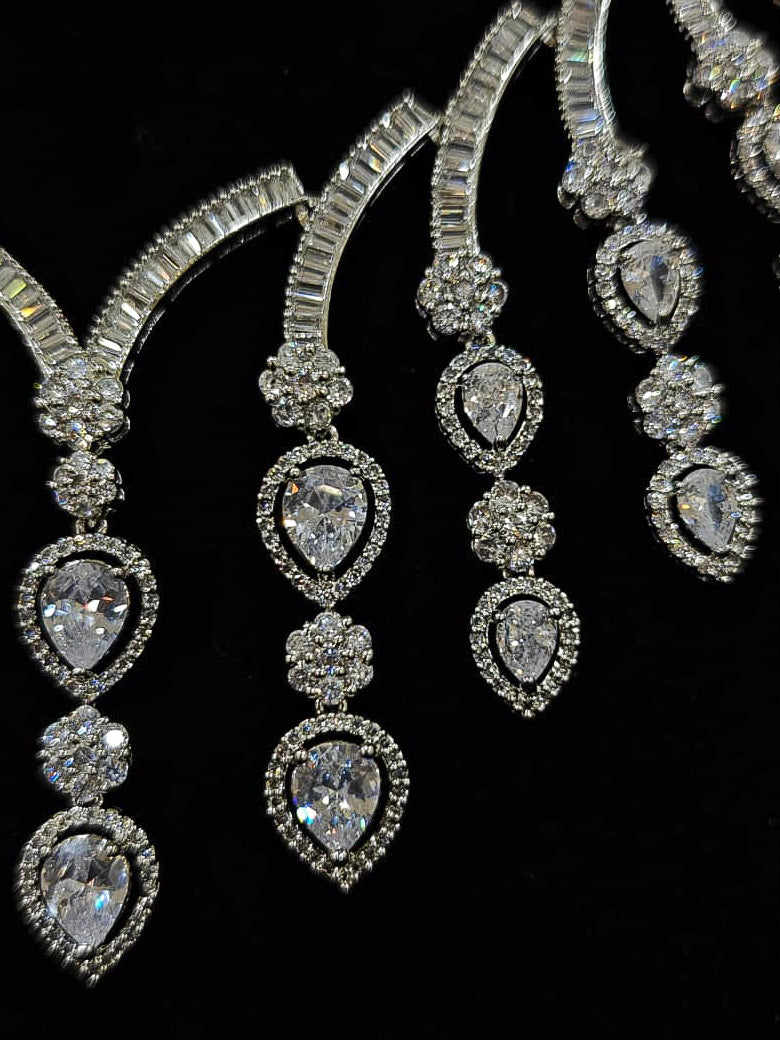 An exquisite artificial diamond necklace and matching earrings, designed for the perfect engagement look. This stunning artificial diamond jewelry set offers luxury and sophistication while being an affordable alternative to natural diamonds.