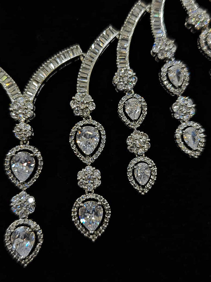 An exquisite artificial diamond necklace and matching earrings, designed for the perfect engagement look. This stunning artificial diamond jewelry set offers luxury and sophistication while being an affordable alternative to natural diamonds.