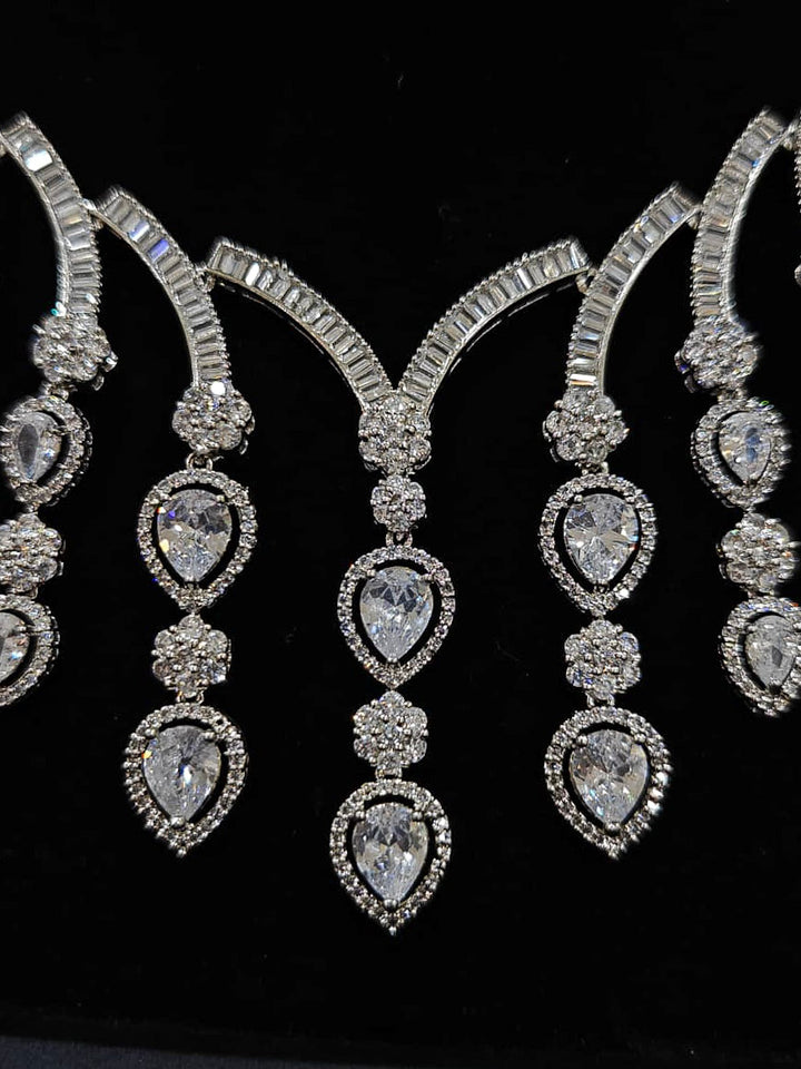 An exquisite artificial diamond necklace and matching earrings, designed for the perfect engagement look. This stunning artificial diamond jewelry set offers luxury and sophistication while being an affordable alternative to natural diamonds.