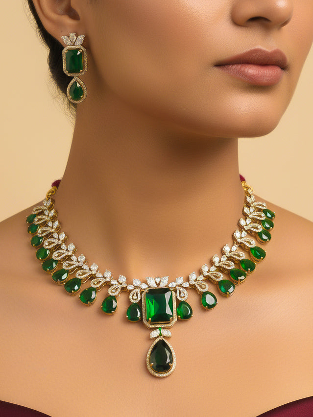 "Close-up of a woman wearing a stunning affordable artificial diamond and emerald green colored stone necklace and matching earrings set, perfect for wedding guests and formal events. This luxury artificial diamond jewelry provides the brilliance of real diamonds at a fraction of the cost."