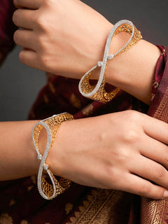 Close-up of a woman wearing an ornate Indo-western Diamond Gold Bangles with American Diamond, Filigree Work and Infinity Design. Wedding guest look completed with lightweight American Diamond artificial bangles. Perfect American Diamond necklace set for weddings and festivals.