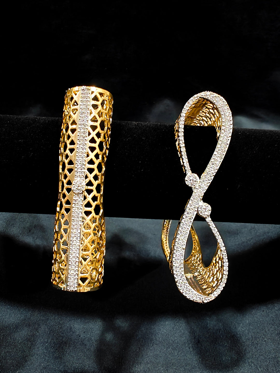 Close-up of an ornate Indo-western Diamond Gold Bangles with American Diamond, Filigree Work and Infinity Design. Wedding guest look completed with lightweight American Diamond artificial bangles. Perfect American Diamond necklace set for weddings and festivals.