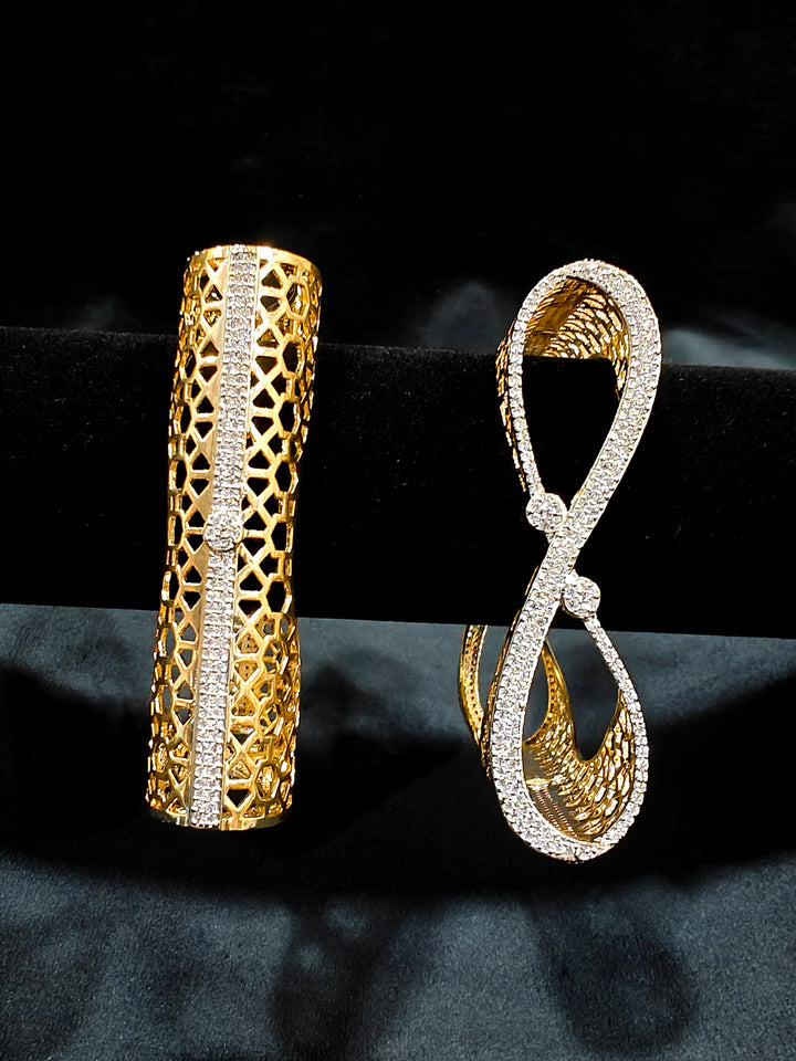 Close-up of an ornate Indo-western Diamond Gold Bangles with American Diamond, Filigree Work and Infinity Design. Wedding guest look completed with lightweight American Diamond artificial bangles. Perfect American Diamond necklace set for weddings and festivals.