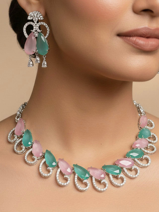"A woman showcasing a beautiful artificial diamond necklace with colored stone and earrings set, ideal for festivals, family gatherings, and special celebrations in India. This elegant diamond jewelry provides the perfect blend of sparkle and tradition, with a modern twist."