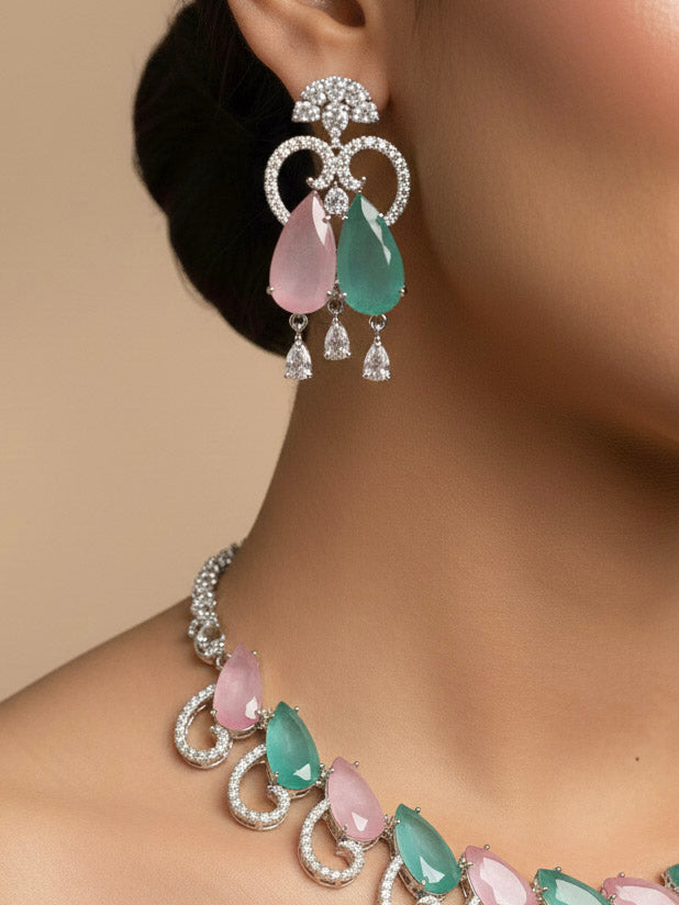 "A stunning woman wearing a glamorous artificial diamond necklace with colored stone paired with chic earrings, perfect for bridal wear. This high-quality artificial diamond jewelry set is the ideal choice for modern brides looking for a budget-friendly option with timeless sparkle."