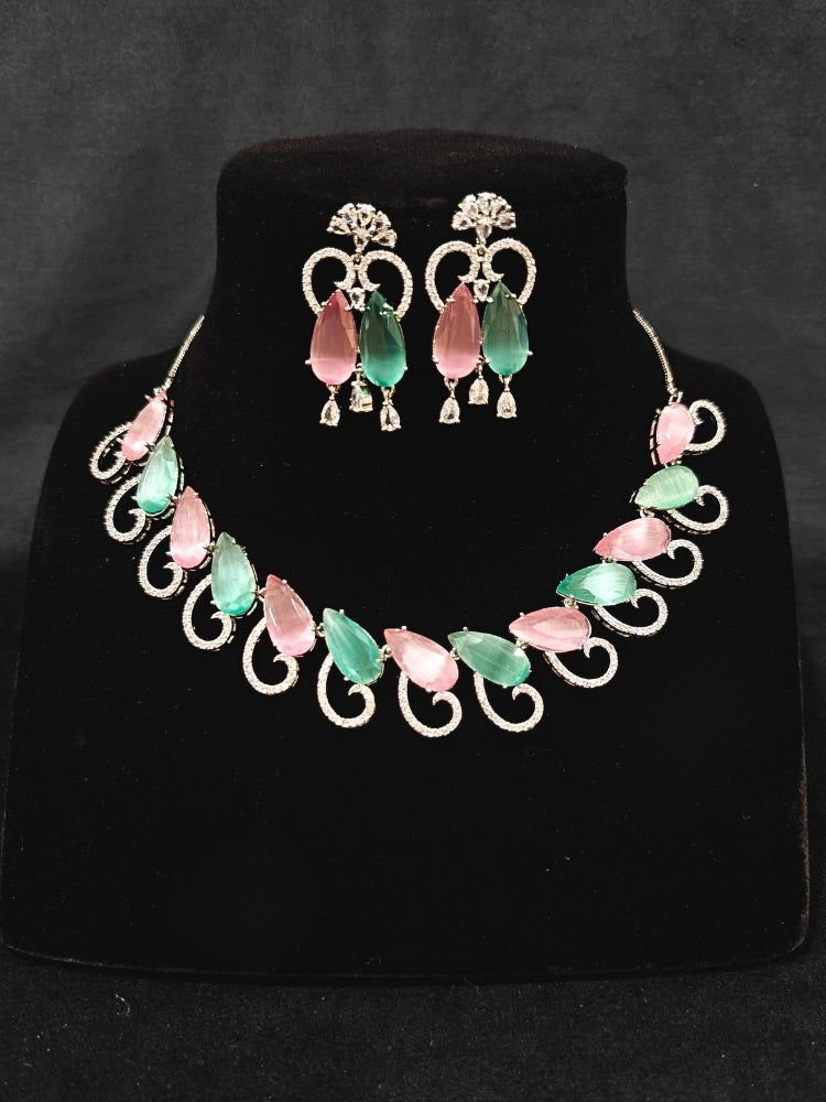 A beautiful artificial diamond necklace with colored stone and earrings set, ideal for festivals, family gatherings, and special celebrations in India. This elegant diamond jewelry provides the perfect blend of sparkle and tradition, with a modern twist.