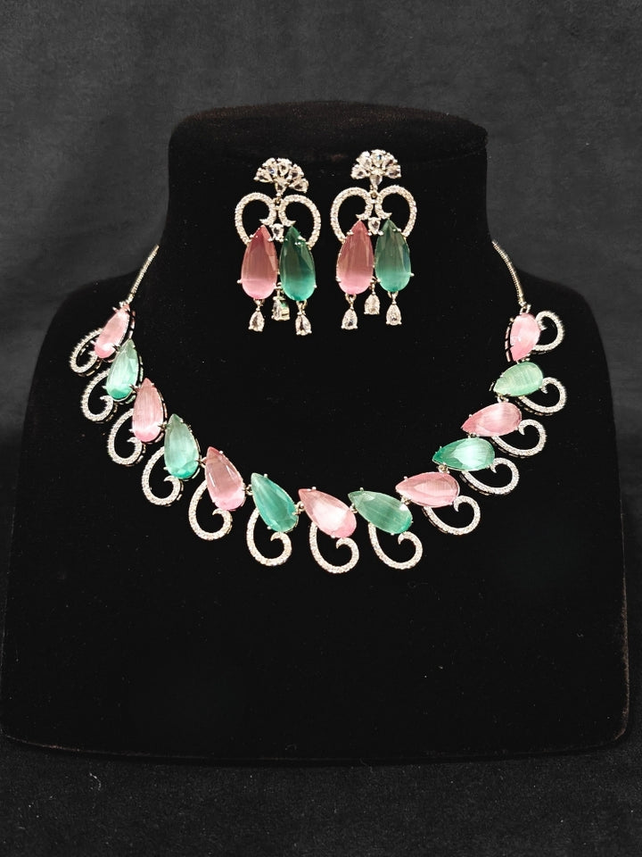 A beautiful artificial diamond necklace with colored stone and earrings set, ideal for festivals, family gatherings, and special celebrations in India. This elegant diamond jewelry provides the perfect blend of sparkle and tradition, with a modern twist.