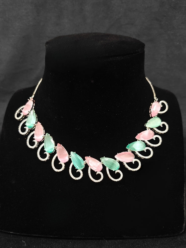 A beautiful artificial diamond necklace with colored stone and earrings set, ideal for festivals, family gatherings, and special celebrations in India. This elegant diamond jewelry provides the perfect blend of sparkle and tradition, with a modern twist.