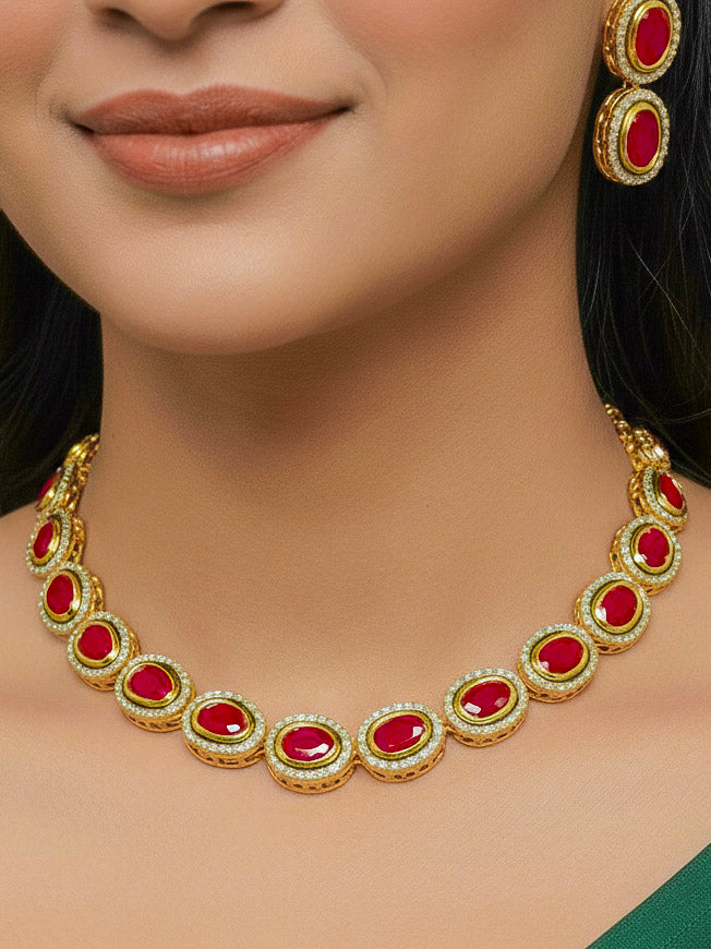 Close-up of a woman wearing an ornate traditional (Gold Polish) Pink Collar jewellery set and earrings with American Diamond and Pink Colored Stone. Festive Diwali outfit paired with a colorful Colored Stone necklace. Festive celebration look enhanced with traditional Colored Stone jewelry.