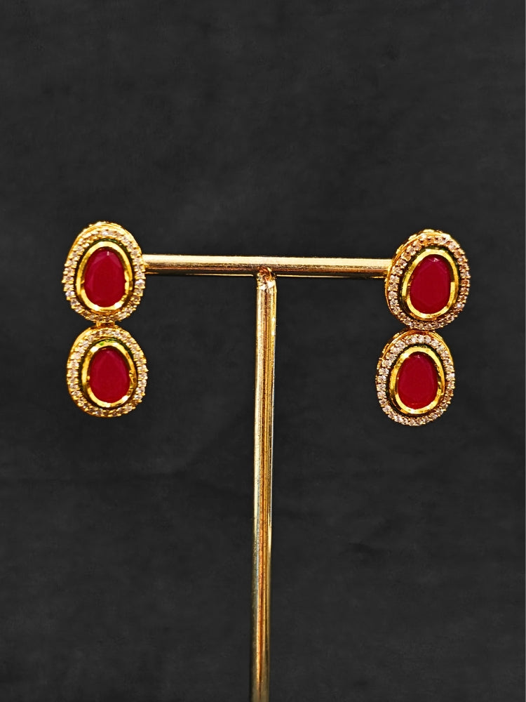 Close-up of an ornate traditional (Gold Polish) Pink Collar jewellery set and earrings with American Diamond and Pink Colored Stone. Festive Diwali outfit paired with a colorful Colored Stone necklace. Festive celebration look enhanced with traditional Colored Stone jewelry.