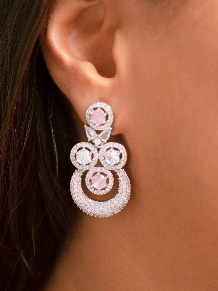 Elegant woman wearing a luxurious artificial diamond necklace with mint pink colored stone matching earrings and maangtikka, perfect for high-profile wedding receptions and formal galas. This high-end artificial diamond jewelry set combines style, elegance, and affordability for special occasions.