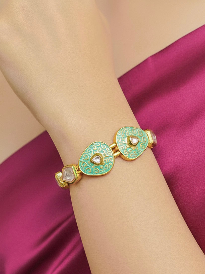 Close-up of a woman wearing an ornate traditional Mint Green Meenakari Bracelet with Meenakari, Kundan and Matt Finish. Festive outfit paired with a premium imitation Meenakari bracelet in India. Festive Diwali look enhanced with an imitation Meenakari bracelet.