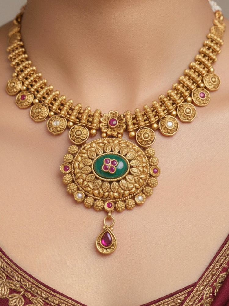Close-up of a woman wearing an ornate traditional Heritage gold Collar jewellery set and earrings with Mint Green Colored Stones. Festive celebration outfit paired with a handcrafted heritage jewelry set.
Festive Diwali outfit styled with a royal heritage necklace.