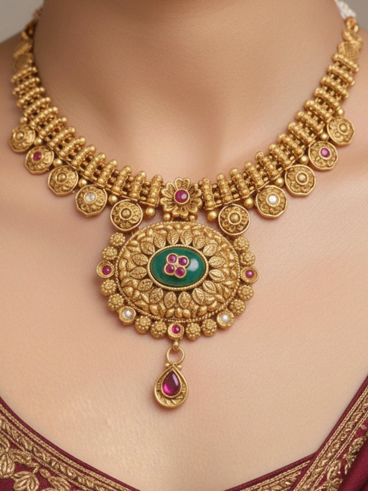 Close-up of a woman wearing an ornate traditional Heritage gold Collar jewellery set and earrings with Mint Green Colored Stones. Festive celebration outfit paired with a handcrafted heritage jewelry set.
Festive Diwali outfit styled with a royal heritage necklace.