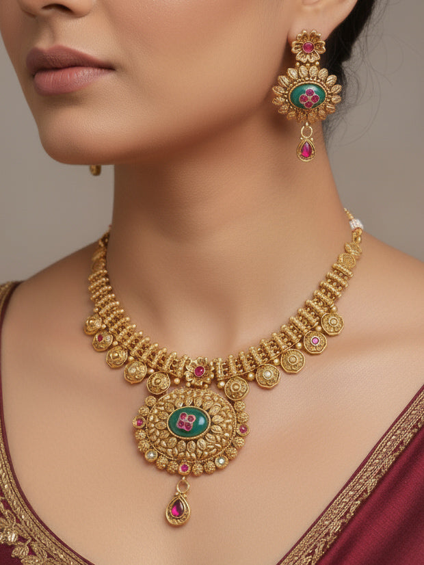 Close-up of a woman wearing an ornate traditional Heritage gold Collar jewellery set and earrings with Mint Green Colored Stones. Festive celebration outfit paired with a handcrafted heritage jewelry set.
Festive Diwali outfit styled with a royal heritage necklace.