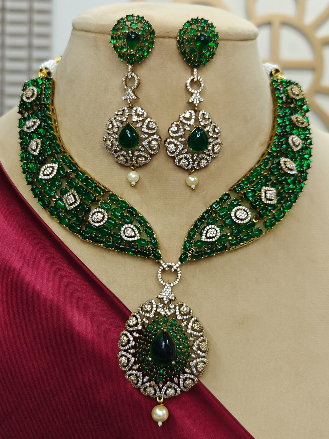 "A bride-to-be wearing an exquisite artificial diamond, pota stone and green colored stone necklace and matching earrings, designed for the perfect engagement look. This stunning artificial diamond jewelry set offers luxury and sophistication while being an affordable alternative to natural diamonds."