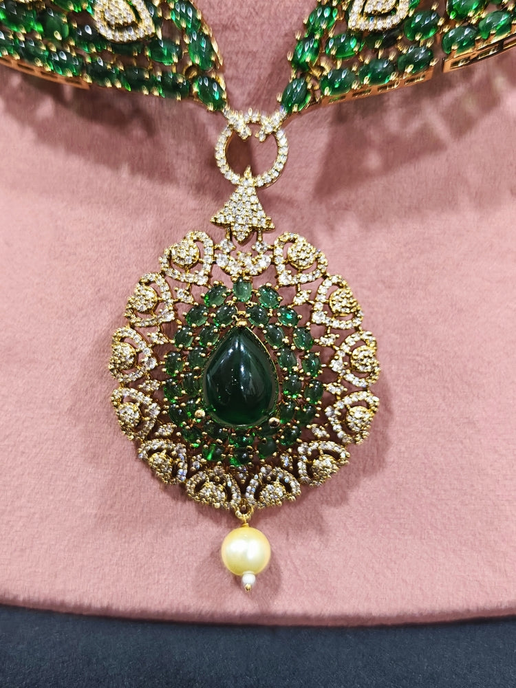 A luxurious artificial diamond jewelry featuring a designer diamond necklace, pota stone and green colored stone and earrings set, crafted for bridal fashion and high-end weddings. This beautiful diamond jewelry set offers the brilliance of real diamonds at an affordable price.