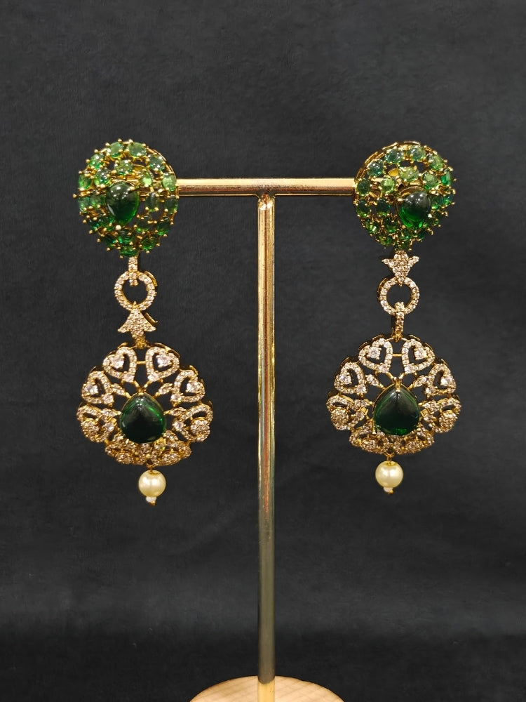 A luxurious artificial diamond jewelry featuring a designer diamond necklace, pota stone and green colored stone and earrings set, crafted for bridal fashion and high-end weddings. This beautiful diamond jewelry set offers the brilliance of real diamonds at an affordable price.