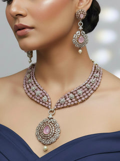 Model wearing the Gizelle mint pink Pota stone and American Diamond necklace set