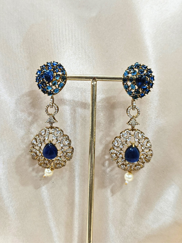 An exquisite artificial diamond, pota stone and navy blue colored stone necklace and matching earrings, designed for the perfect engagement look. This stunning artificial diamond jewelry set offers luxury and sophistication while being an affordable alternative to natural diamonds.