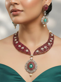 Model wearing the Gizelle red and mint green Pota stone and American Diamond necklace set