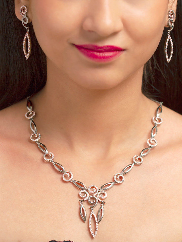 Close-up of a woman wearing a sparkling artificial diamond necklace and diamond earrings set, designed to offer a radiant, elegant look for any formal occasion or Indian wedding. This affordable diamond jewelry provides a flawless, luxurious alternative to natural diamonds.