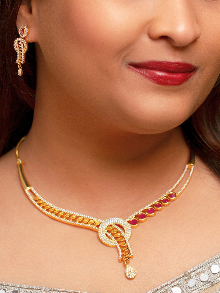Close-up of a woman wearing a sparkling artificial diamond necklace with red colored stone and diamond earrings set, designed to offer a radiant, elegant look for any formal occasion or Indian wedding. This affordable diamond jewelry provides a flawless, luxurious alternative to natural diamonds.