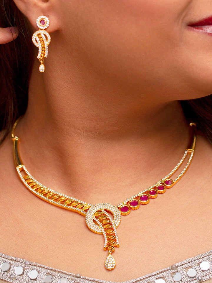 A beautiful woman wearing an elegant artificial diamond necklace with red colored stone and matching earrings. This premium artificial diamond jewelry set is perfect for special occasions, from Indian weddings to engagement parties, offering sophisticated glamour without the high price tag.