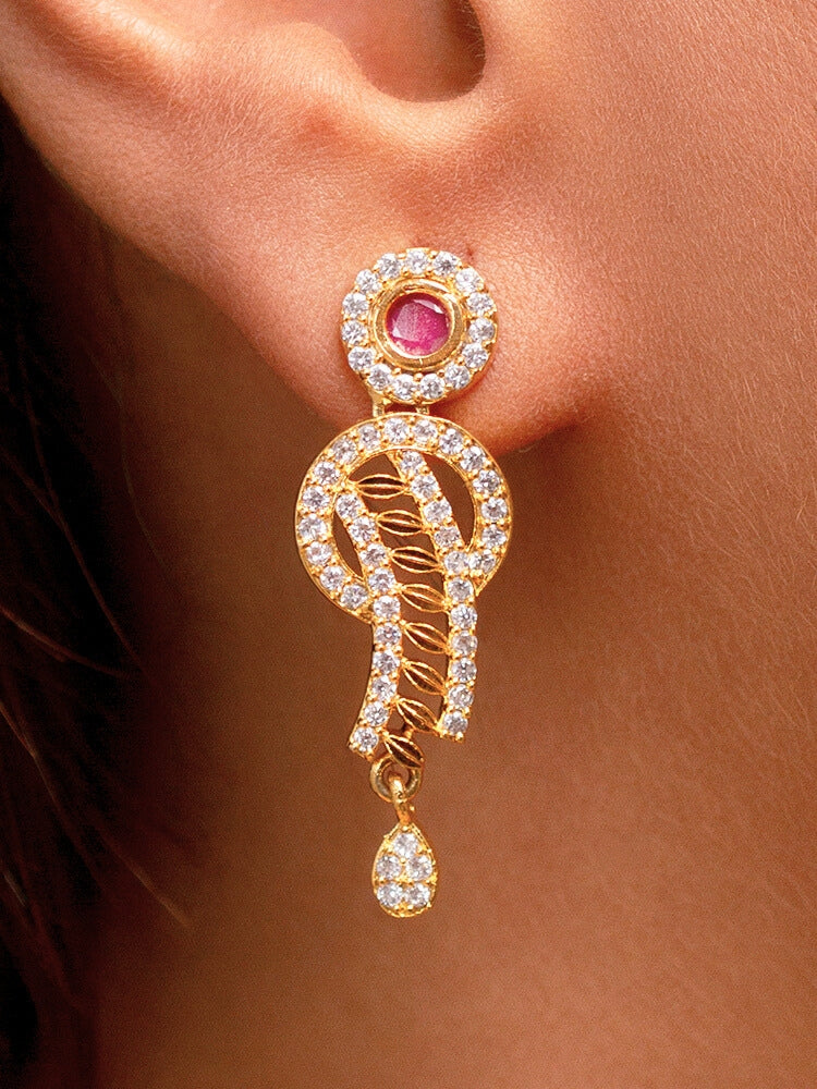 Close-up of a woman wearing a stunning affordable artificial diamond necklace with red colored stone and matching earrings set, perfect for wedding guests and formal events. This luxury artificial diamond jewelry provides the brilliance of real diamonds at a fraction of the cost.