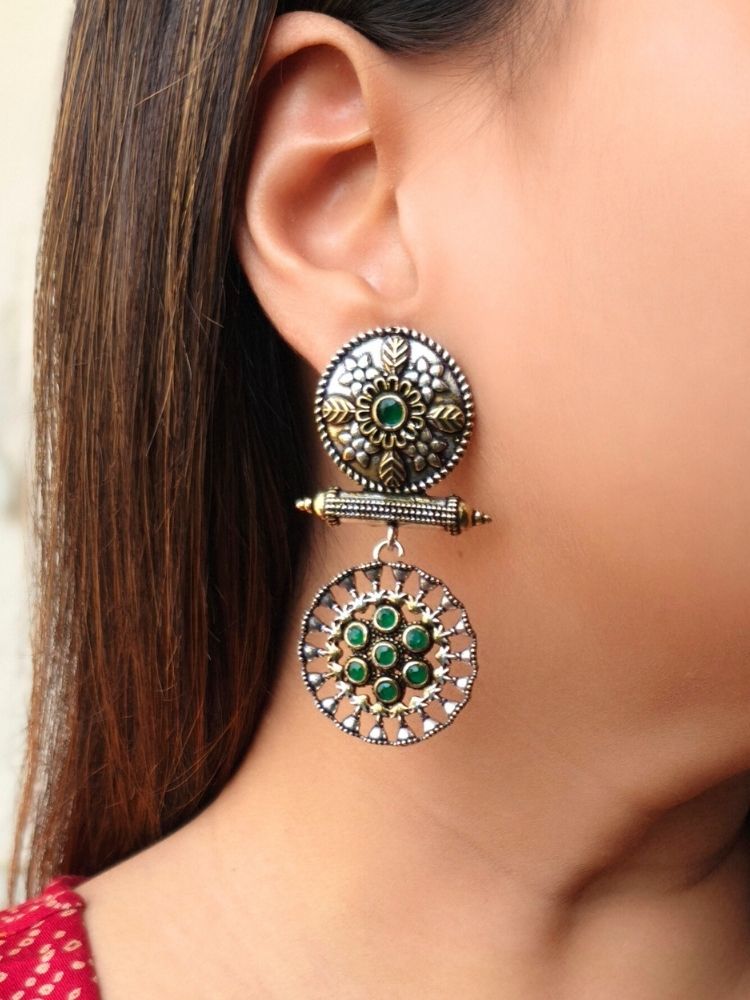 Close-up of a woman wearing an ornate traditional (Dual Tone Polish) Green Oxidised Earrings set with Kundan. Festive celebration look enhanced with sparkling artificial Oxidised Earrings. Saree look completed with elegant artificial Earrings set for festive occasions.