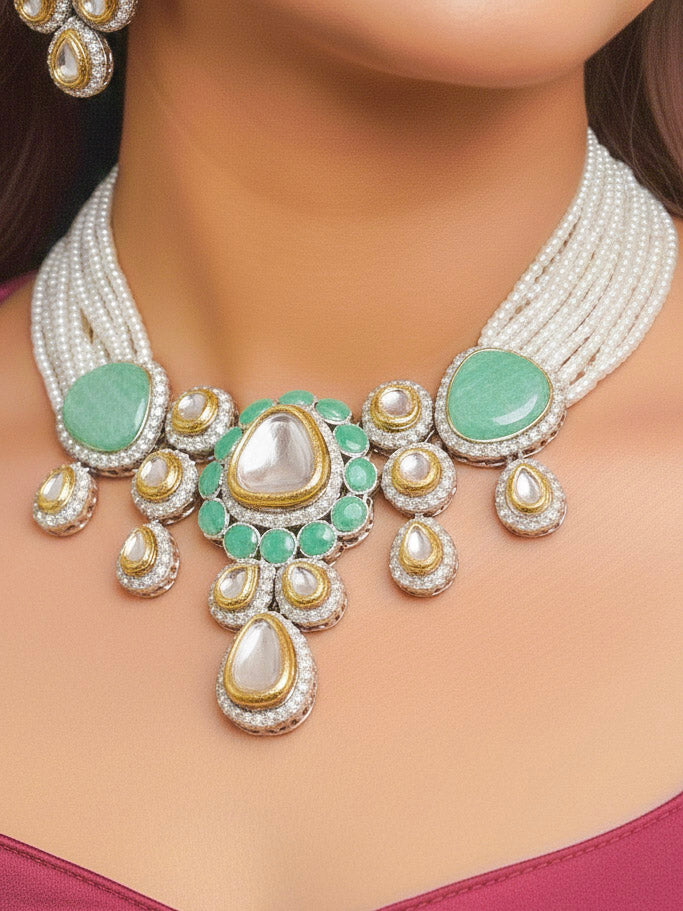 Close-up of a woman wearing an ornate traditional Green Collar Kundan jewellery set and earrings with American diamonds, Monalisa stone, Pearls, Kundan and Colored Stones. Festive Diwali outfit paired with a premium Kundan jewelry piece. Woman wearing trending Kundan artificial jewelry for wedding season in India.