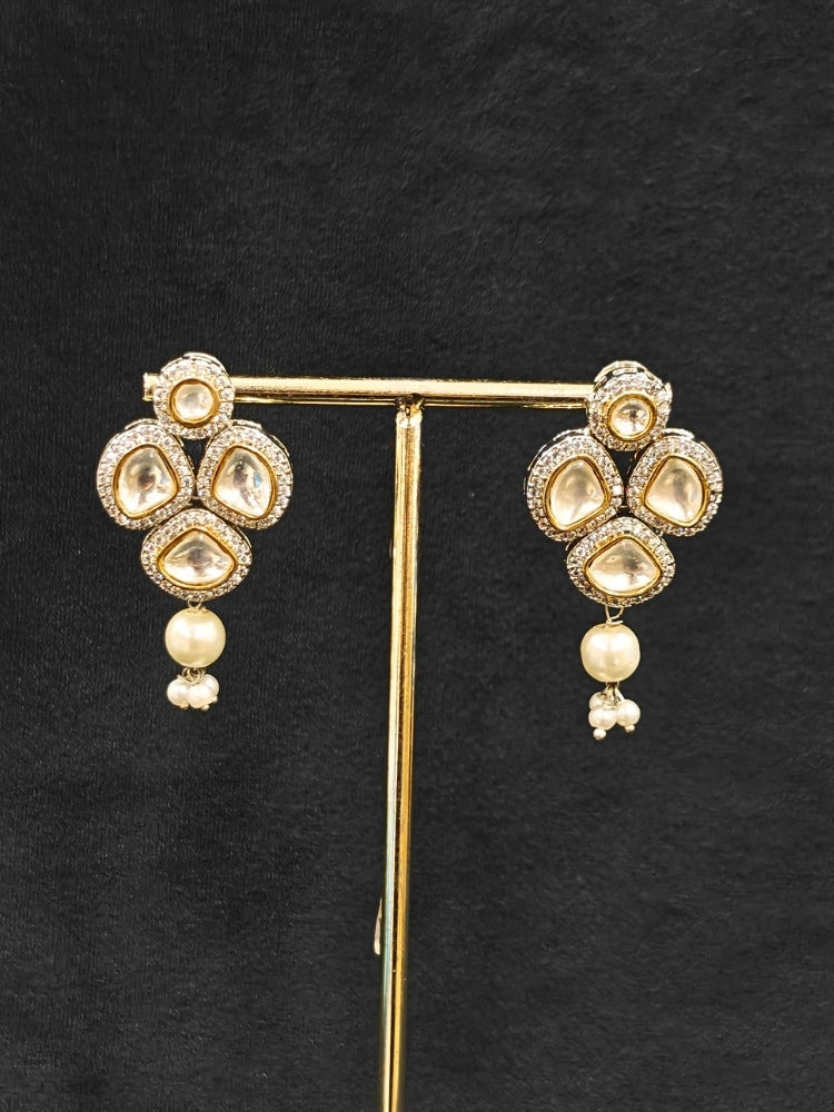 Close-up of an ornate traditional Grey Long jewellery set and earrings with Kundan, American Diamond, pearls and Crystal Beads. Mehendi ceremony look completed with a handcrafted Kundan jewelry set. Wedding guest wearing a lightweight Kundan necklace for a Wedding function.