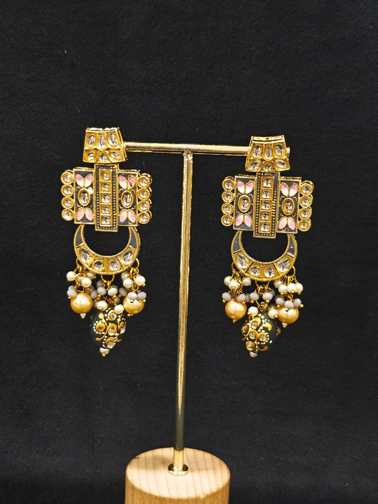 Close-up of an ornate traditional Grey Rajwadi and Meenakari gold Long jewellery set and earrings  with Kundan, Meenakari work, crystal beads and pearls.  A royal Rajwadi and Meenakari artificial necklace set for a traditional Indian wedding. Luxury imitation Rajwadi and Meenakari necklace worn for wedding celebrations.