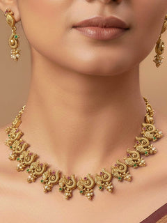 Woman wearing the Gulbahar matte gold collar necklace set with matching earrings, styled for a haldi function.