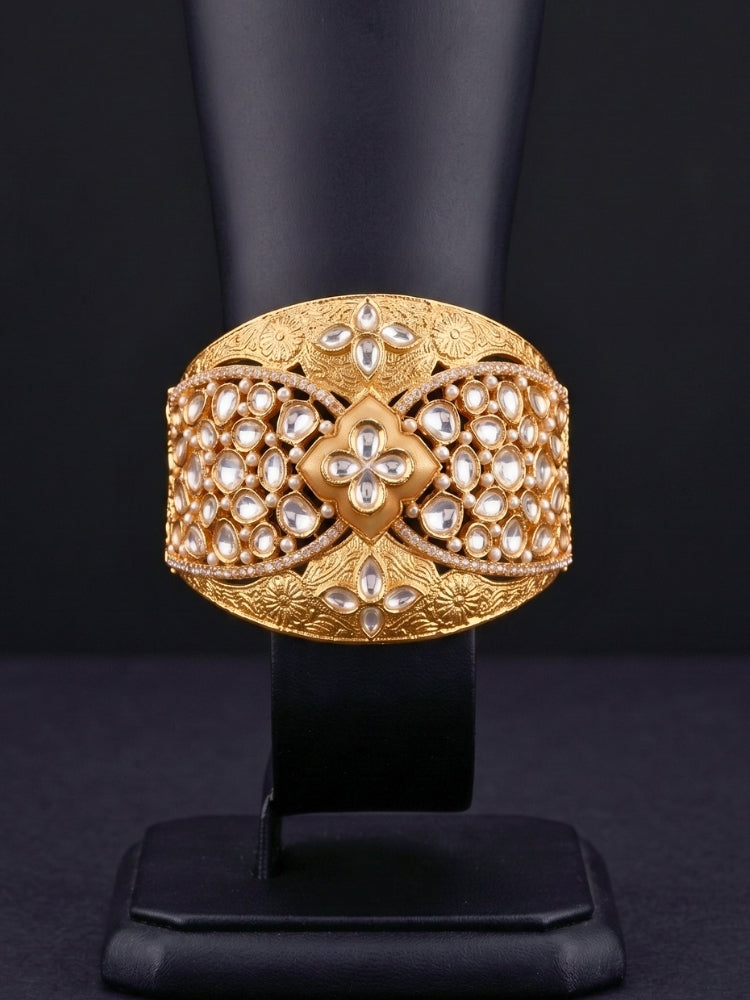 Close-up of an ornate traditional (Gold Polish) Gold Bracelet with Polki and American Diamond. Woman showcasing a premium artificial Polki bracelet for wedding celebrations. Festive Diwali look enhanced with an imitation Polki bracelet.