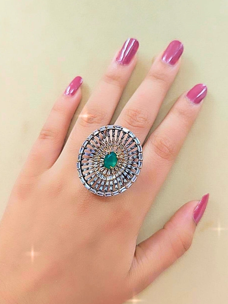 Close-up of a woman wearing an ornate Indo-Western (Black Polish Victorian Finish) Green Diamond Ring with American Diamond and Colored Stones. Close-up of a cocktail party look featuring a premium American diamond Ring. Close-up shot of a high-quality American diamond artificial Ring worn for festive celebrations.