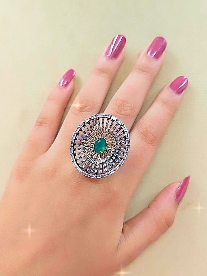 Close-up of a woman wearing an ornate Indo-Western (Black Polish Victorian Finish) Green Diamond Ring with American Diamond and Colored Stones. Close-up of a cocktail party look featuring a premium American diamond Ring. Close-up shot of a high-quality American diamond artificial Ring worn for festive celebrations.