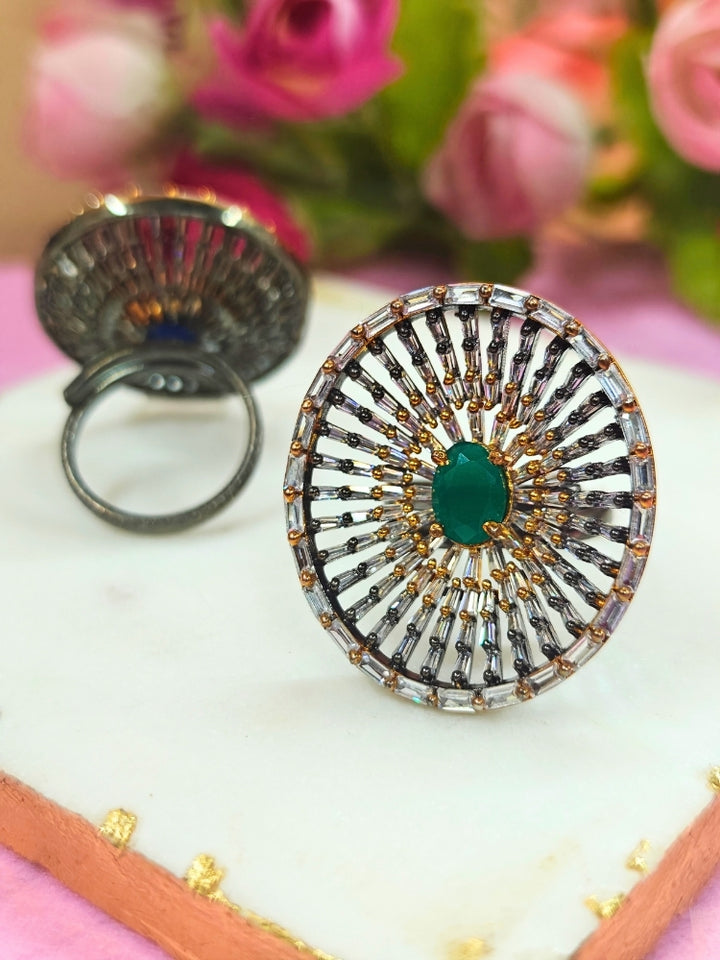 Close-up of an ornate Indo-Western (Black Polish Victorian Finish) Green Diamond Ring with American Diamond and Colored Stones. Close-up of a cocktail party look featuring a premium American diamond Ring. Close-up shot of a high-quality American diamond artificial Ring worn for festive celebrations.