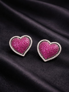 Close-up of a woman wearing an ornate Western (Black Polish Victorian Finish) Pink Studs Earrings with American Diamond and Colored Stones. Close-up shot of a high-quality American diamond artificial Studs Earrings worn for festive celebrations. 