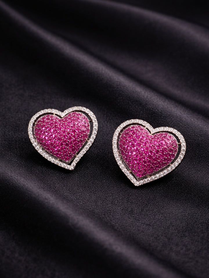 Close-up of a woman wearing an ornate Western (Black Polish Victorian Finish) Pink Studs Earrings with American Diamond and Colored Stones. Close-up shot of a high-quality American diamond artificial Studs Earrings worn for festive celebrations. 