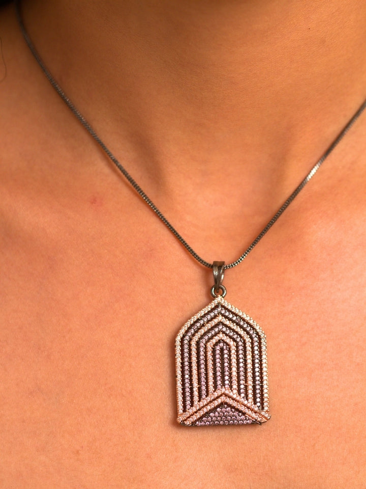 Close-up of a woman wearing an ornate Western Purple and Pink (Black Polish Victorian Finish) Diamond jewellery set and earrings with American Diamonds and Close-Setting. Close-up of a cocktail party look featuring a premium American diamond necklace.