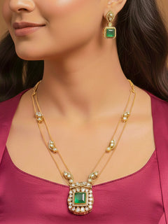 Close-up of a woman wearing an ornate traditional (Gold Polish) Mint Green jewellery set and earrings with Kundan and Colored Stones. Indo-western outfit styled with a lightweight Kundan necklace.  Festive saree styling with a premium artificial Kundan necklace.