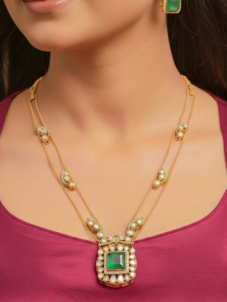 Close-up of a woman wearing an ornate traditional (Gold Polish) Mint Green jewellery set and earrings with Kundan and Colored Stones. Indo-western outfit styled with a lightweight Kundan necklace.  Festive saree styling with a premium artificial Kundan necklace.
