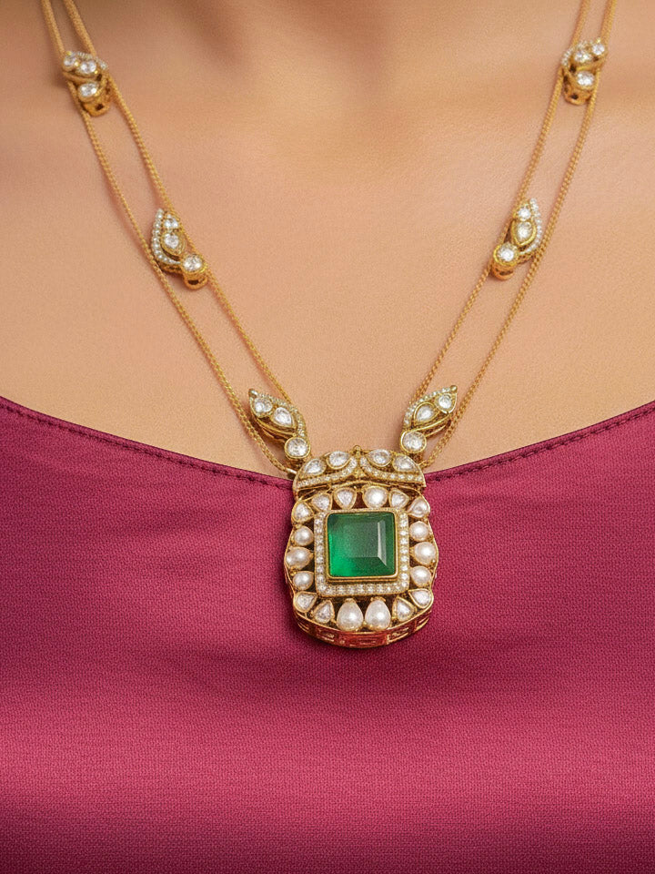 Close-up of a woman wearing an ornate traditional (Gold Polish) Mint Green jewellery set and earrings with Kundan and Colored Stones. Indo-western outfit styled with a lightweight Kundan necklace.  Festive saree styling with a premium artificial Kundan necklace.