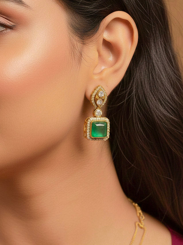 Close-up of a woman wearing an ornate traditional (Gold Polish) Mint Green jewellery set and earrings with Kundan and Colored Stones. Indo-western outfit styled with a lightweight Kundan necklace.  Festive saree styling with a premium artificial Kundan necklace.