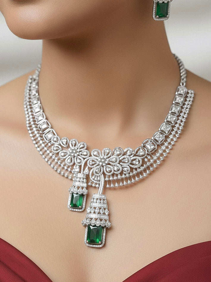 "Elegant woman wearing a luxurious artificial diamond necklace with green colored stone and matching earrings, perfect for high-profile wedding receptions and formal galas. This high-end artificial diamond jewelry set combines style, elegance, and affordability for special occasions."
