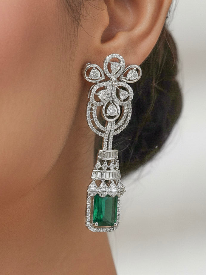 "A woman showcasing a beautiful artificial diamond necklace with green colored stone and earrings set, ideal for festivals, family gatherings, and special celebrations in India. This elegant diamond jewelry provides the perfect blend of sparkle and tradition, with a modern twist."
